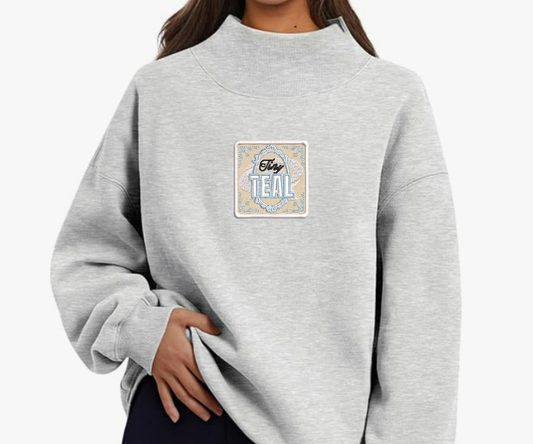 Embroidered Tiny Teal Mock Neck